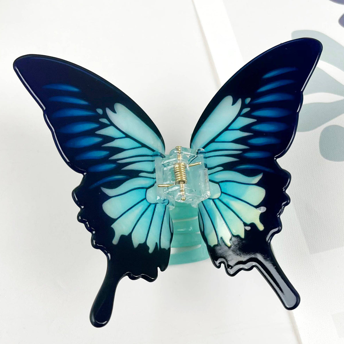 Butterfly-shaped hair clip on a white background